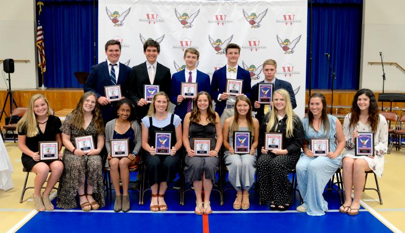 Accepting individual awards are in back (l-r) Matt Durkin, varsity tennis, Most Improved; Dominic Anthony, varsity tennis MVP, singles champ, ESIAC Player of the Year; Will Todd, varsity tennis Coaches Award; Dakin Moore, varsity lacrosse Coaches Award; Hunter Gentry, varsity lacrosse MVP, ESIAC Player of the Year. Not pictured: J.P. Issel, varsity lacrosse Most Improved.
In front are Kaitlin Cronin, JV lacrosse Most Improved; Audrey Stearns, JV lacrosse Coaches Award; Maya Natesan, varsity tennis Most Improved; Abi Plylar, varsity tennis MVP, singles champ, ESIAC Player of the Year; Annika Larsen, varsity tennis Coaches Award; Carly Hoffman, varsity lacrosse MVP and ESIAC Player of the Year; Chloe Ruddo, varsity lacrosse Coaches Award; Abbi Nechay, varsity lacrosse Most Improved; and Julia Godwin, JV lacrosse MVP.